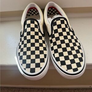 Vans Black and Cream Checkerboard Slip-On Sneakers